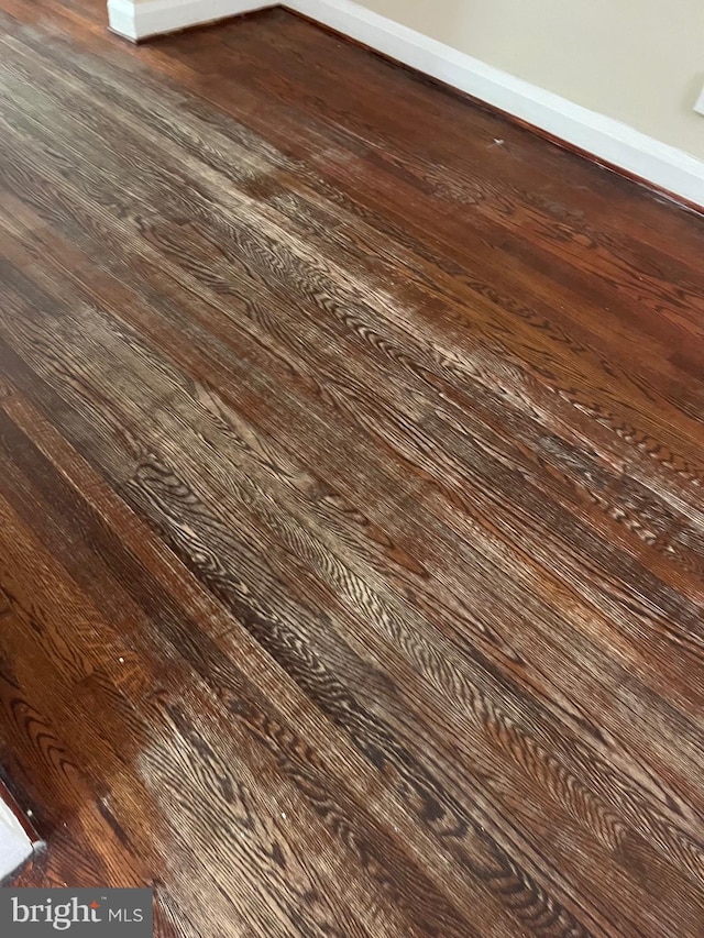 437 52nd St, Baltimore, MD 21224 - detailed view of wood finished floors and baseboards