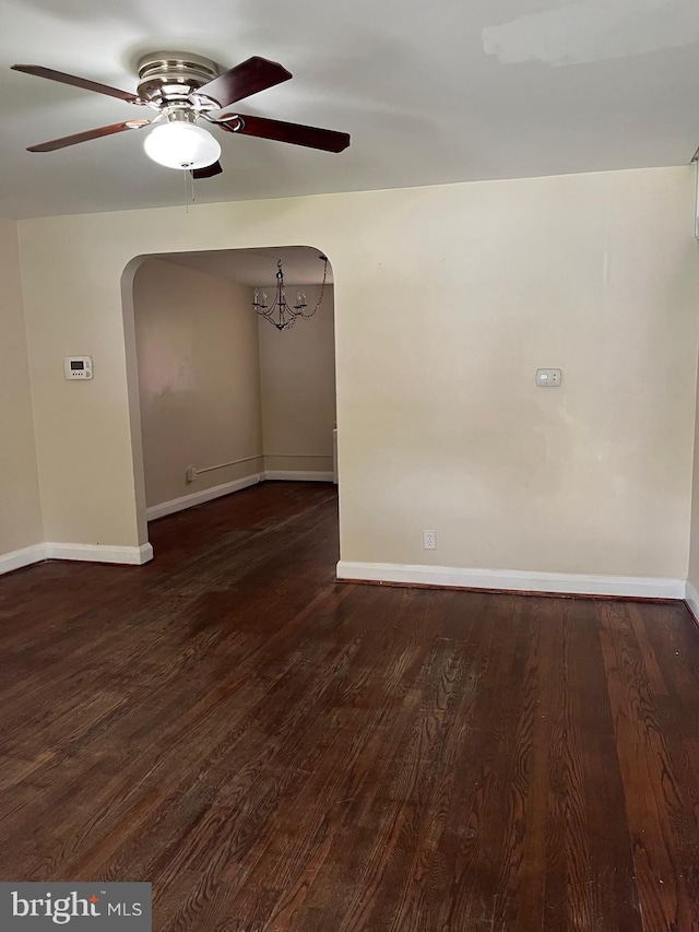 437 52nd St, Baltimore, MD 21224 - spare room with arched walkways, ceiling fan, and baseboards