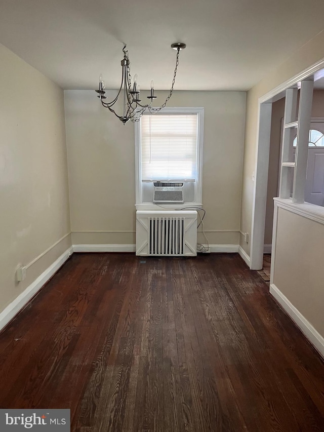 437 52nd St, Baltimore, MD 21224 - unfurnished dining area with radiator heating unit, a chandelier, wood finished floors, baseboards, and cooling unit