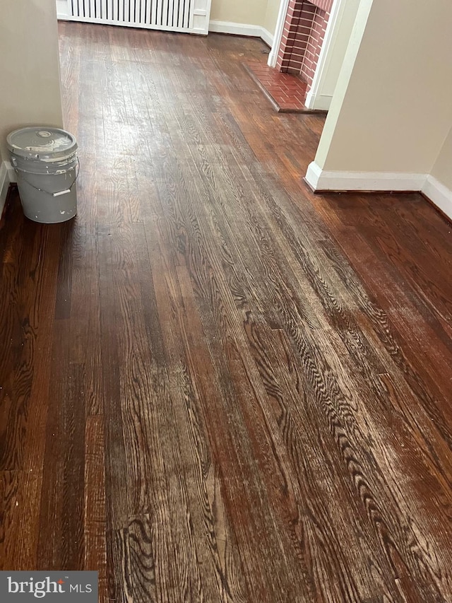 437 52nd St, Baltimore, MD 21224 - detailed view of baseboards and wood finished floors