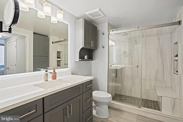 851 N Glebe Rd Unit 406, Arlington, VA 22203 - bathroom featuring a shower stall, toilet, and vanity