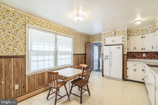 800 Little Shiloh Rd, West Chester, PA 19382 - dining room featuring a wainscoted wall, wallpapered walls, light flooring, and wooden walls