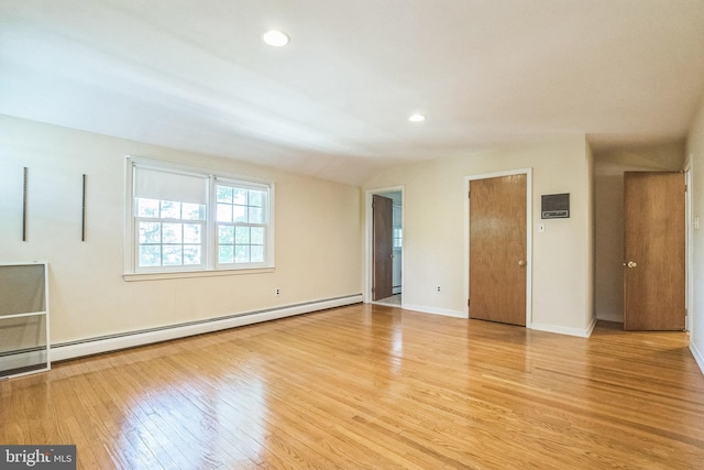 800 Little Shiloh Rd, West Chester, PA 19382 - spare room with baseboard heating, light wood-style floors, vaulted ceiling, baseboards, and recessed lighting