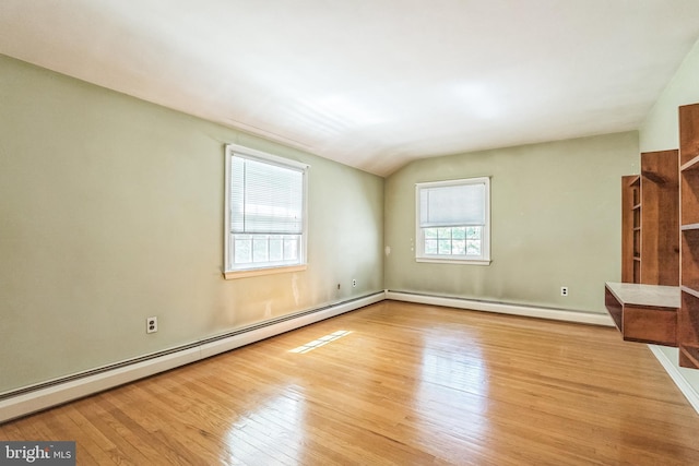 800 Little Shiloh Rd, West Chester, PA 19382 - unfurnished living room featuring baseboard heating, hardwood / wood-style flooring, a baseboard radiator, lofted ceiling, and baseboards
