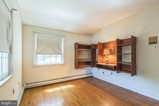 800 Little Shiloh Rd, West Chester, PA 19382 - spare room with a baseboard radiator, wood finished floors, and lofted ceiling
