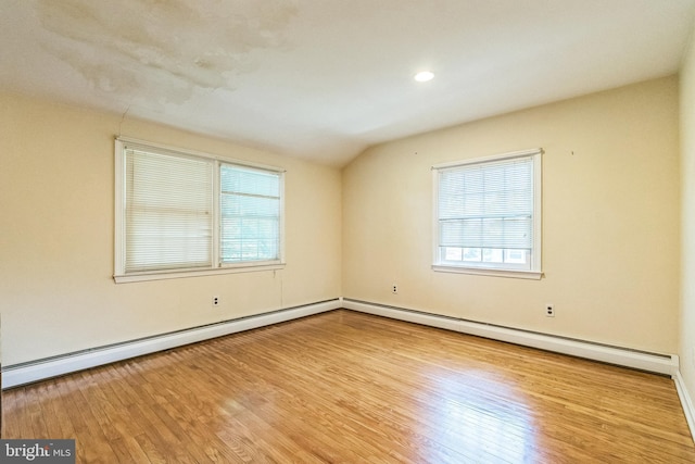 800 Little Shiloh Rd, West Chester, PA 19382 - empty room featuring plenty of natural light, wood finished floors, vaulted ceiling, baseboard heating, and baseboards