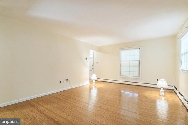 800 Little Shiloh Rd, West Chester, PA 19382 - empty room with wood finished floors, a baseboard heating unit, and baseboards