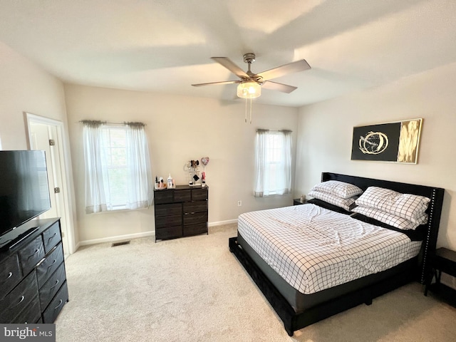 bedroom featuring carpet flooring, baseboards, and ceiling fan