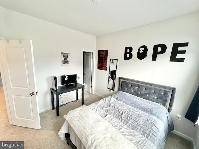 carpeted bedroom featuring baseboards