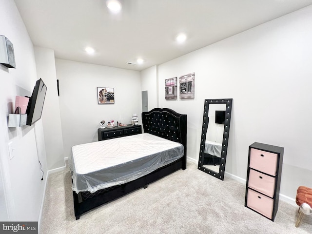carpeted bedroom featuring recessed lighting and baseboards