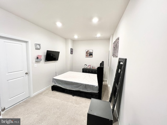 carpeted bedroom featuring recessed lighting and baseboards