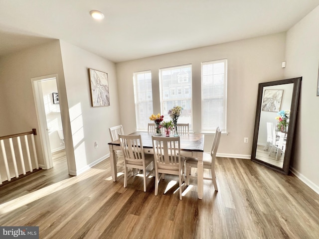 dining room with wood finished floors and baseboards