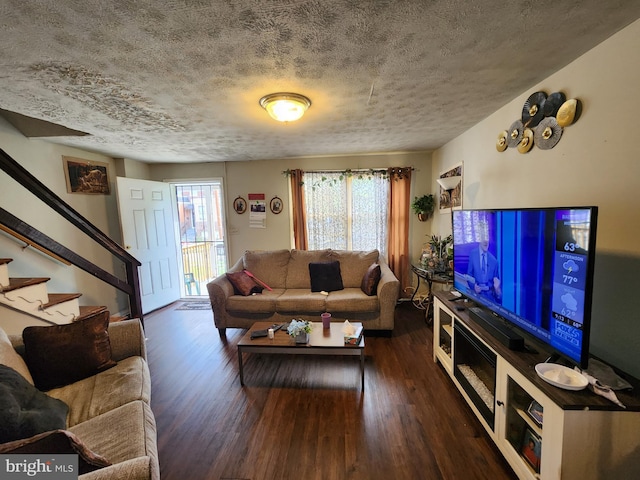 1351 Cambria St, Baltimore, MD 21225 - living area featuring wood finished floors, stairs, and a textured ceiling