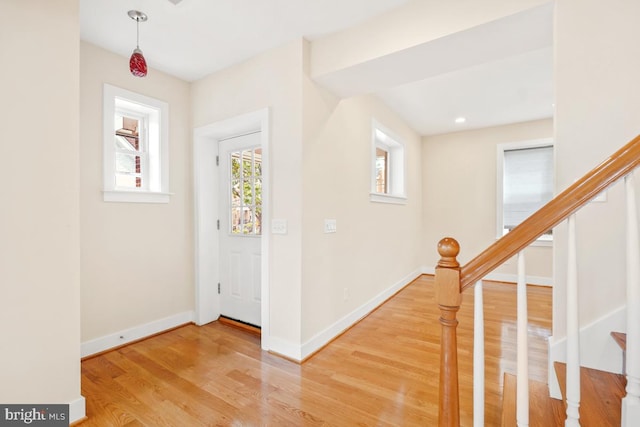 1706 Otis St NE, Washington, DC 20018 - foyer entrance with light wood-style flooring, baseboards, and stairs