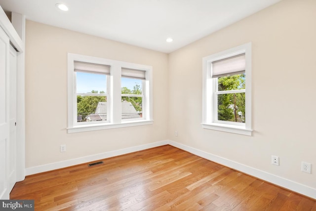 1706 Otis St NE, Washington, DC 20018 - unfurnished bedroom with light wood-style floors, a closet, baseboards, and recessed lighting