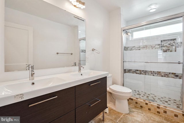 1706 Otis St NE, Washington, DC 20018 - bathroom featuring toilet, a stall shower, and double vanity