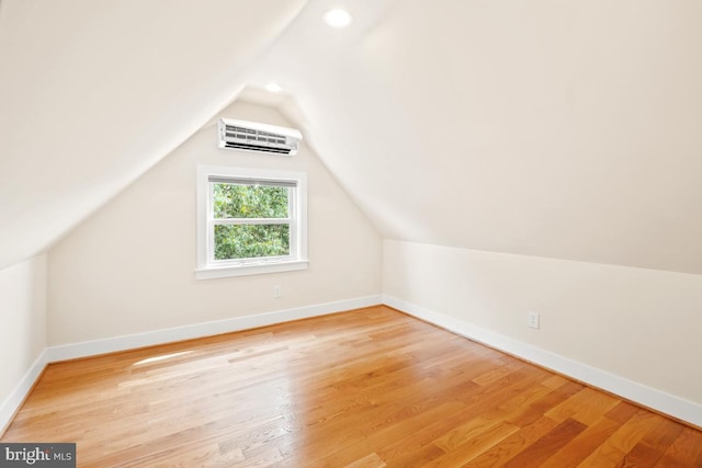 1706 Otis St NE, Washington, DC 20018 - additional living space with a wall unit AC, baseboards, vaulted ceiling, light wood-style flooring, and recessed lighting