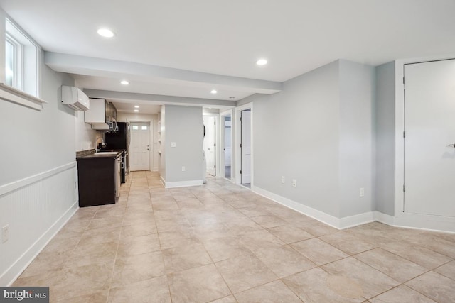 1706 Otis St NE, Washington, DC 20018 - unfurnished living room featuring recessed lighting, a wall mounted air conditioner, a sink, and light tile patterned floors