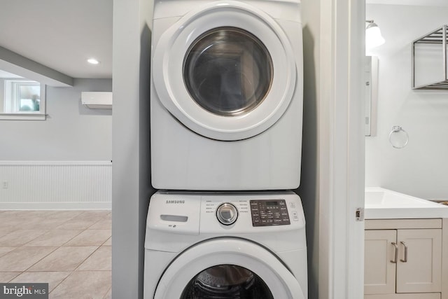 1706 Otis St NE, Washington, DC 20018 - washroom featuring estacked washer and dryer, wainscoting, light tile patterned flooring, a wall unit AC, and recessed lighting