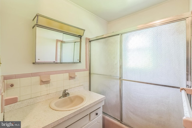 21821 Cove Ln, Leonardtown, MD 20650 - bathroom with crown molding, tile walls, vanity, and shower / bath combination with glass door
