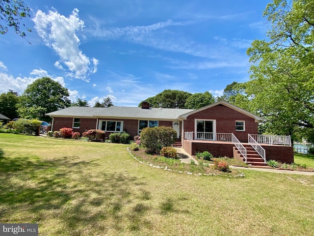 21821 Cove Ln, Leonardtown, MD 20650 - ranch-style house featuring brick siding, a front lawn, stairs, and a deck