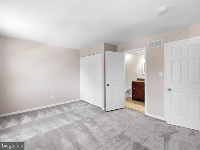 9 Patrick Henry Ct, Newark, DE 19711 - unfurnished bedroom with carpet floors, a closet, and ensuite bathroom