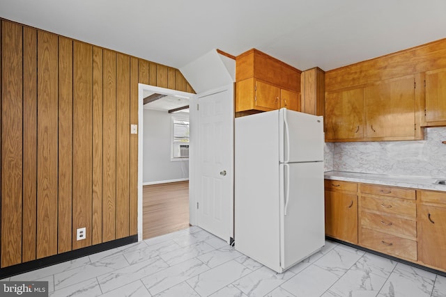 3142 Yorkway, Baltimore, MD 21222 - kitchen with freestanding refrigerator, light marble finish floors, light countertops, wood walls, and brown cabinetry