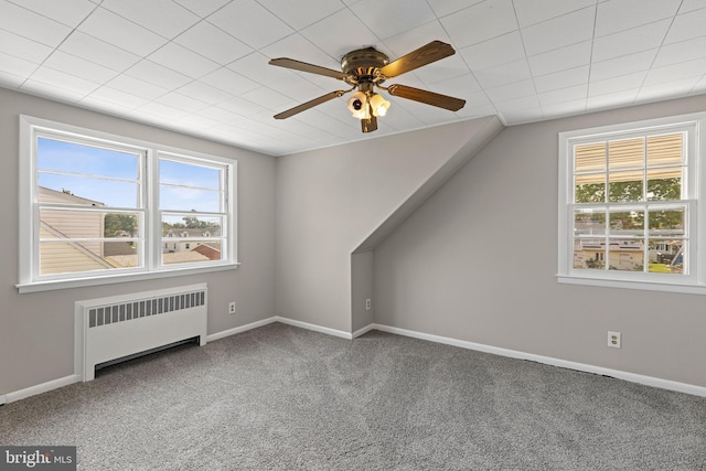 3142 Yorkway, Baltimore, MD 21222 - additional living space with radiator heating unit, carpet, a ceiling fan, and lofted ceiling