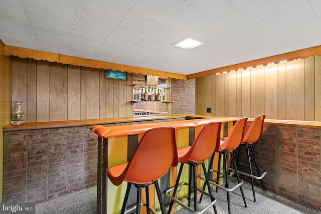 3142 Yorkway, Baltimore, MD 21222 - indoor dry bar featuring carpet floors and wooden walls