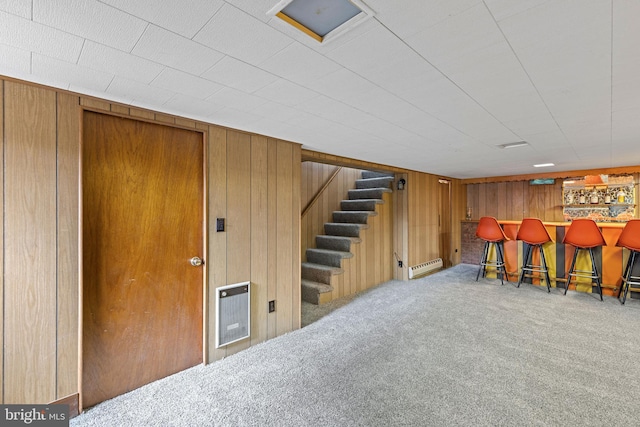 3142 Yorkway, Baltimore, MD 21222 - indoor dry bar with stairway, carpet floors, wooden walls, a baseboard radiator, and heating unit