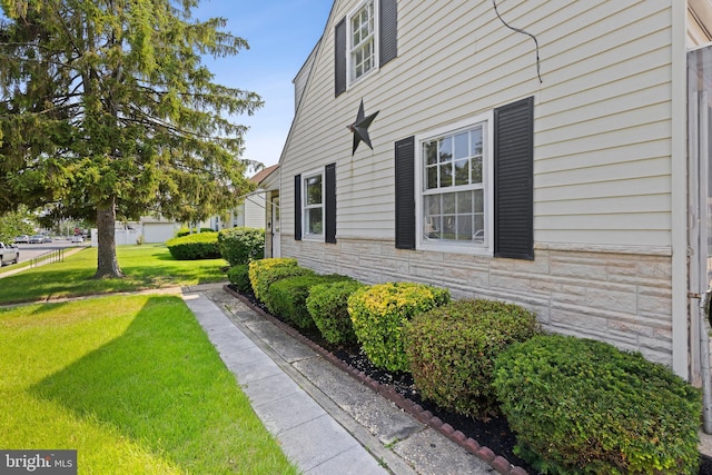 3142 Yorkway, Baltimore, MD 21222 - view of property exterior with stone siding and a lawn