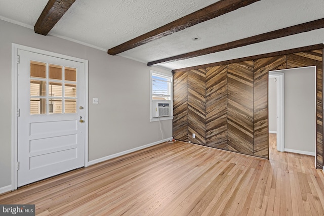3142 Yorkway, Baltimore, MD 21222 - entrance foyer with light wood-style floors, beamed ceiling, cooling unit, wood walls, and a textured ceiling