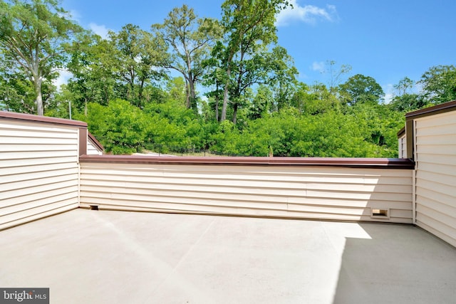 view of patio featuring view of scattered trees