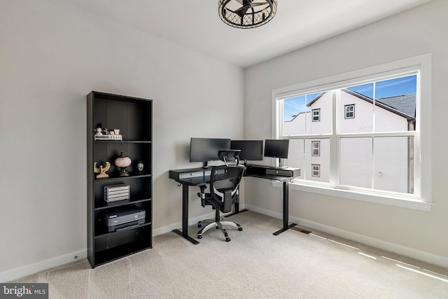 office featuring light carpet and baseboards