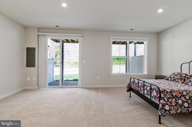 carpeted bedroom with access to outside, baseboards, electric panel, and recessed lighting