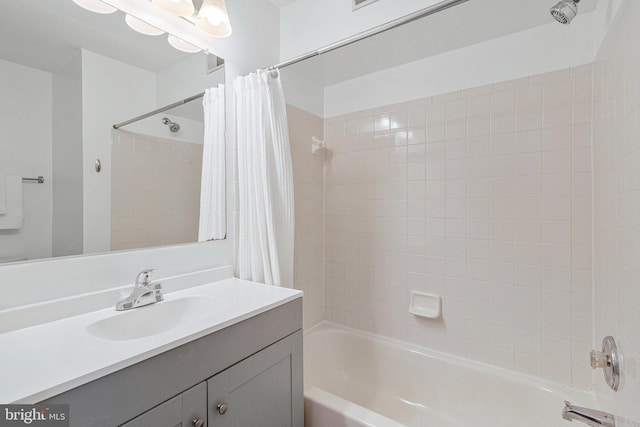 bathroom with shower / bath combination with curtain and vanity