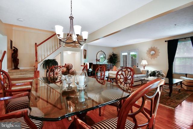 630 Brookedge Ct, Bowie, MD 20721 - dining area featuring plenty of natural light, wood finished floors, stairs, and a chandelier