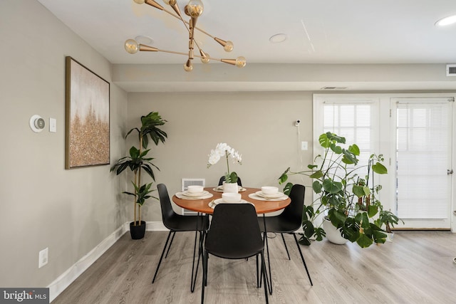 12705 Gordon Blvd Unit 37, Woodbridge, VA 22192 - dining space with wood finished floors and a chandelier
