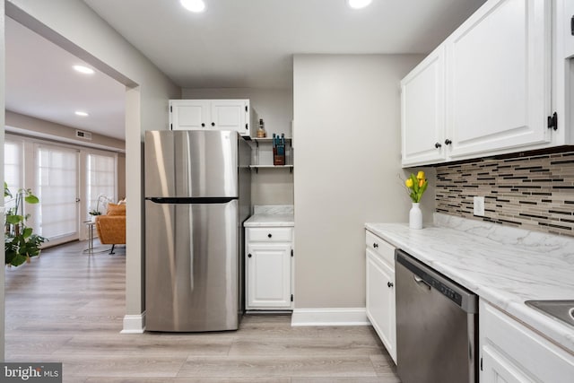12705 Gordon Blvd Unit 37, Woodbridge, VA 22192 - kitchen featuring stainless steel appliances, recessed lighting, white cabinets, backsplash, and light wood-style flooring