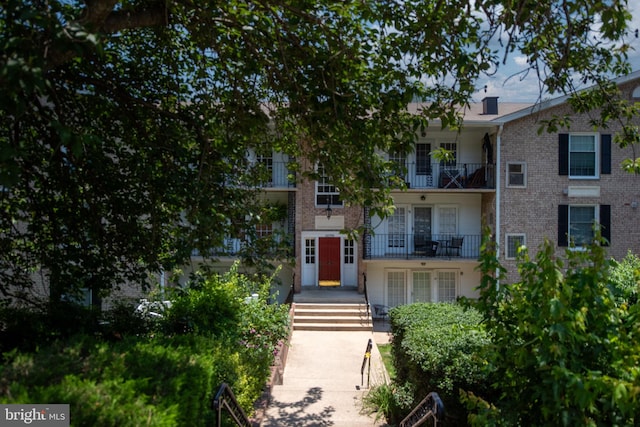 12705 Gordon Blvd Unit 37, Woodbridge, VA 22192 - view of front of house featuring a balcony and brick siding