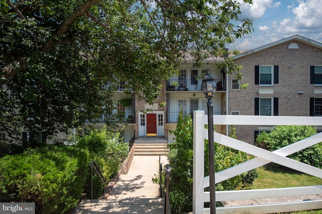 12705 Gordon Blvd Unit 37, Woodbridge, VA 22192 - view of front of house with brick siding and a balcony