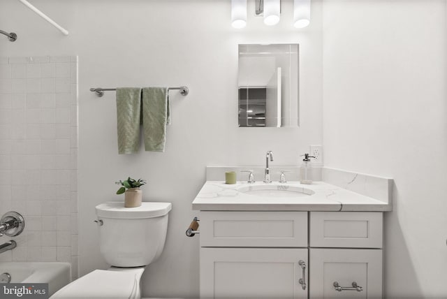 bathroom with toilet, tub / shower combination, and vanity