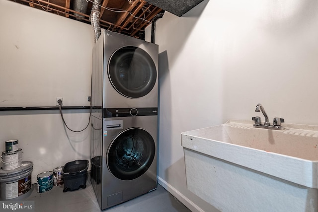 laundry room featuring estacked washer and dryer