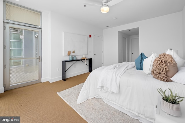 bedroom with carpet flooring and baseboards