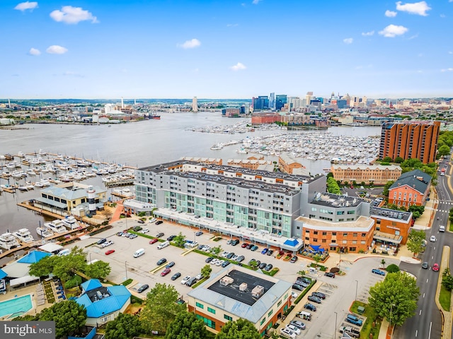 view of urban area with a nearby body of water and numerous boat docks