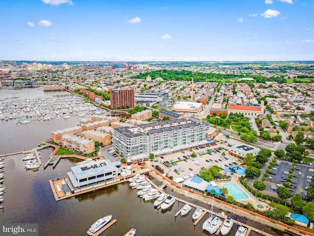 bird's eye view of numerous boat docks and a nearby body of water