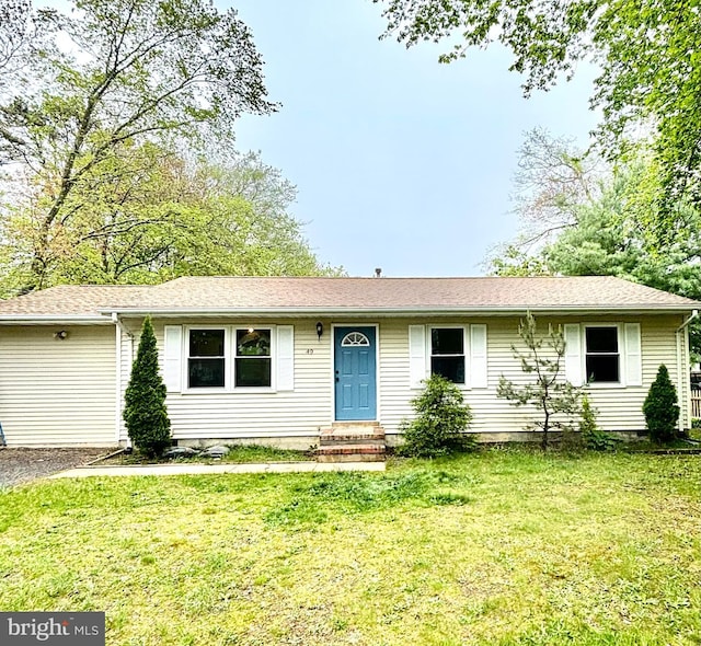 ranch-style home with a front lawn