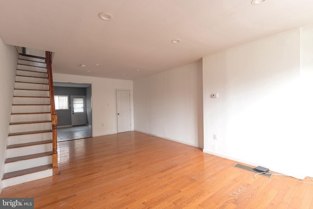2106 S 12th St, Philadelphia, PA 19148 - empty room with light wood-style floors, stairs, and recessed lighting