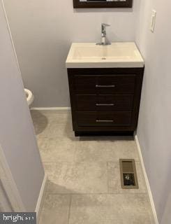 2106 S 12th St, Philadelphia, PA 19148 - bathroom featuring vanity, tile patterned flooring, baseboards, and toilet