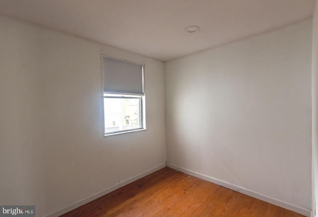 2106 S 12th St, Philadelphia, PA 19148 - empty room with light wood finished floors and baseboards